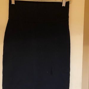 Bodycon black skirt just above the knee